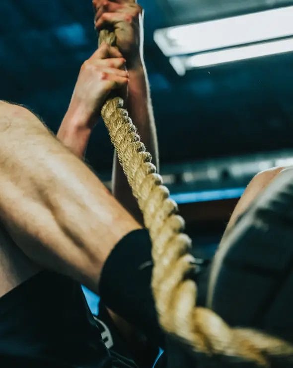 Man climbing rope